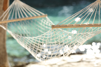 Hammock On A Tropical Beach Resort Vacation Concept